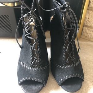 Enzo Angiolini. Black short booties . Size 8 . Open front and back.